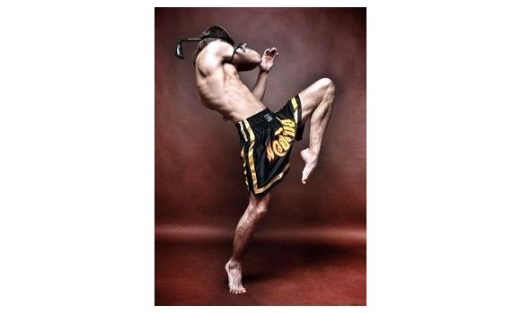Premium Photo | Muay thai athlete posing middle kick.